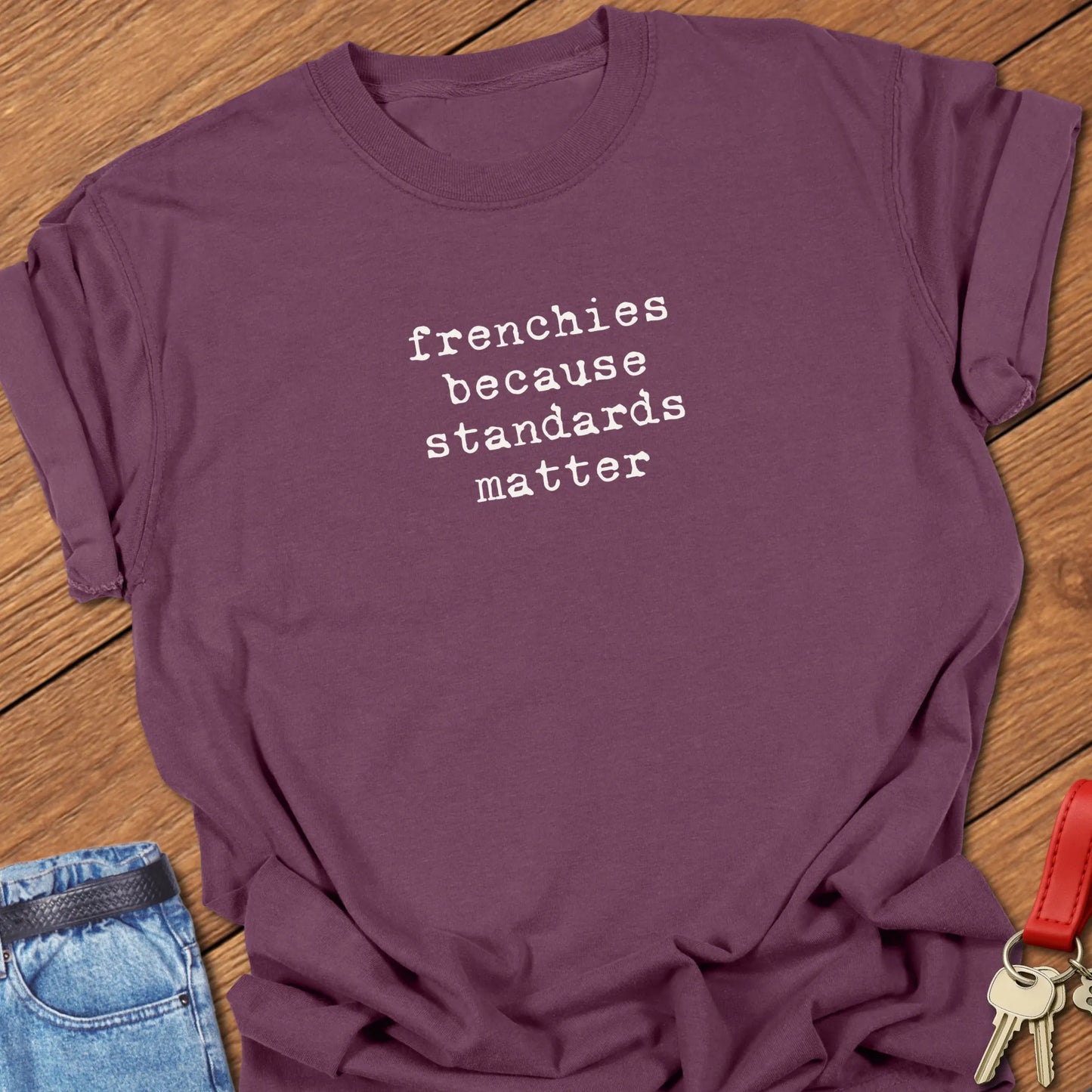 A Comfort Colors® t-shirt in Berry featuring the phrase "Frenchies Because Standards Matter" in popular retro typewriter font designed for casual everyday wear.