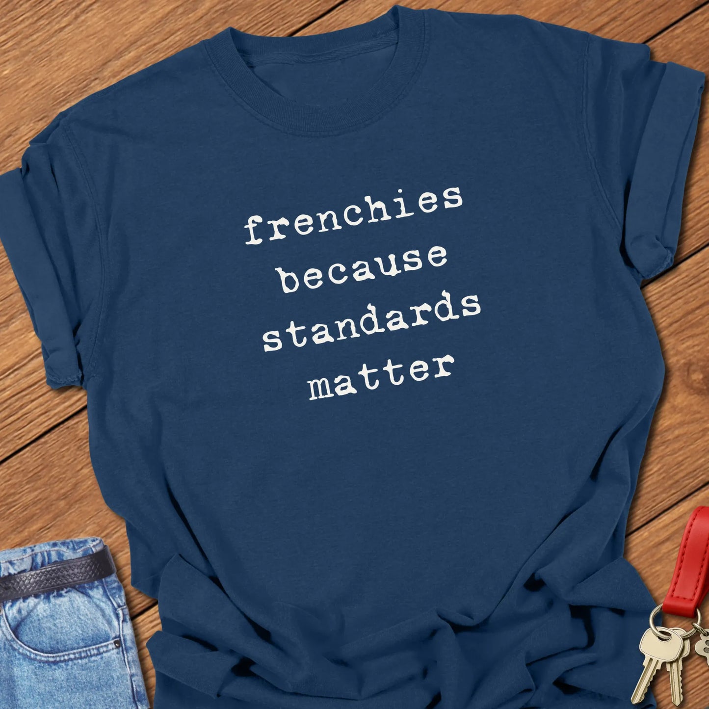 Typewriter-style typography featuring the slogan "Frenchies Because Standards Matter" printed on a Comfort Colors® garment-dyed t-shirt in True Navy color.